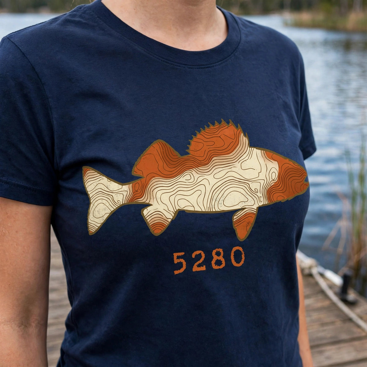 Topo Walleye tee worn, design close-up — Navy shirt (dock)